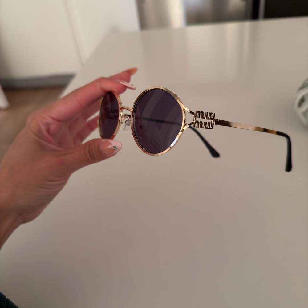 Miu Miu Gold Frame Sunglasses with Purple Lenses